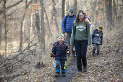 Family hiking at Schramm Park State Recreation Area in winter