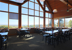 Interior of Mahoney's restaurant with large windows and seating