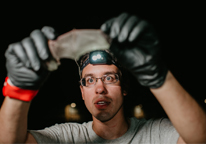 Researcher looking at a bat's wing