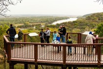 People gathered at Indian Cave State Park's overlook in fall.