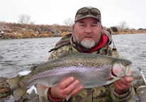 Daryl Bauer holding a large rainbow trout