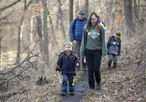 Family hiking at Schramm Park State Recreation Area in winter