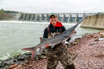 Woman holding paddlefish