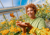 PhD student Miyauna Incarnato in the butterfly lab at UNL.