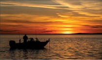 Fishing boat on Lake McConaughy at sunset