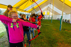 Girl practicing archery at Fort Kearny Expo