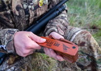 Hunter using a box call