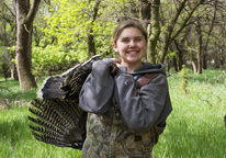 Girl holding a harvested turkey