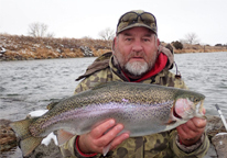 Angler holding a rainbow trout