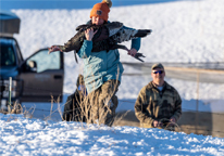 Researcher carrying turkey to its release