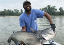 Man holding a record blue catfish