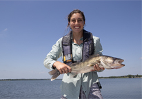 Woman holding a walleye