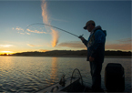 Silhouette of an angler fishing