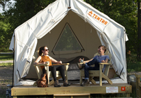 Couple sitting at a Tentrr campsite