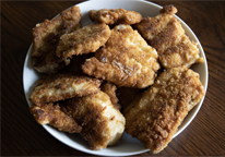 A plate of fried carp fillets.