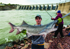 Boy holding paddlefish