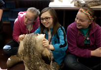 Girls looking at a badger hide