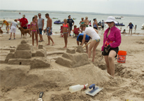 Woman building a sandcastle at Lake McConaughy