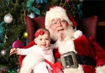 Santa holding baby on his lap