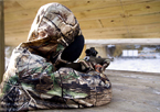 Youth sighting in her muzzleloader rifle at the range