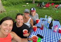 Friends around a picnic table