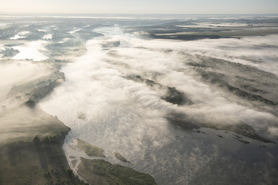 Aerial view of fog covering the Platte River in early morning light