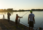 People fishing from a dock