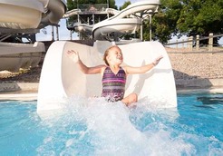 Girl sliding down water slide at Mahoney State Park