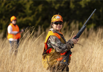 Female pheasant hunter in the field