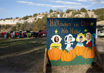 Kids posing for a picture at Ash Hollow Halloween event