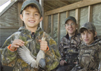 Kids in a waterfowl blind