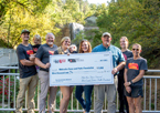 Vanderheiden family holding check