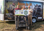 Game and Parks staff holding check