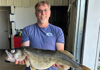 Angler holding a state record walleye