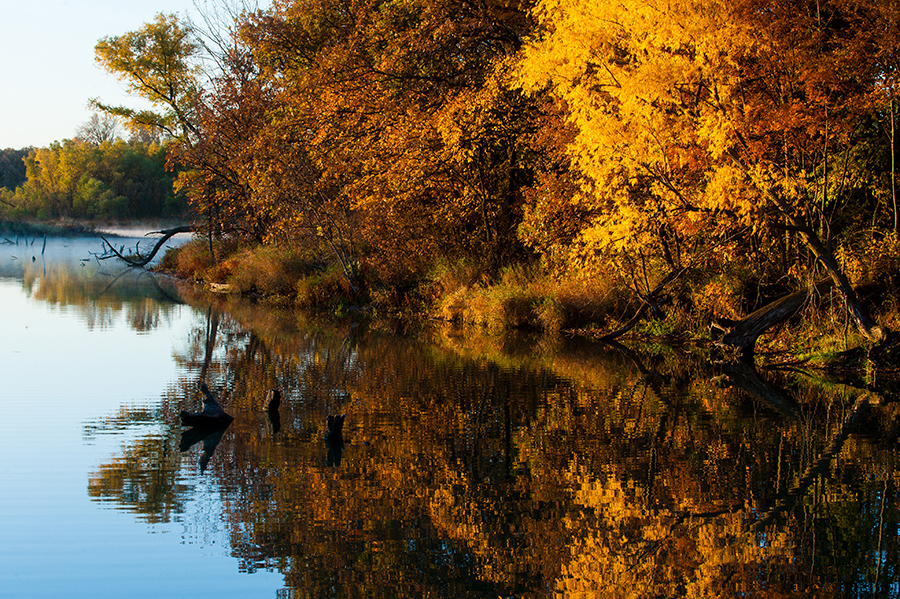 Fall colors reflect in the lake at Olive Creek State Recreation Area