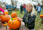 Girl carving a pumpkin at a Nebraska state park