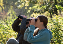 Women using binoculars to look for birds at Indian Cave State Park