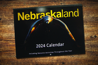 Cover of 2024 Nebraskaland calendar on wooden background