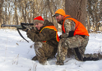 Hunters using a muzzleloader in the field