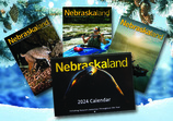 Nebraskaland covers and 2024 calendar on wintry background