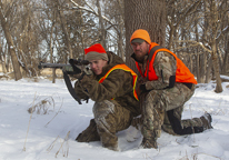 Father and son hunting deer with a muzzleloader