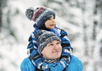 Father and son hiking in snowy woods