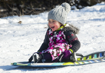 Little girl sledding at a Nebraska state park