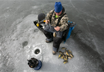 Overhead view of an angler fishing through the ice