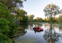 People paddleboating at Victoria Springs State Recreation Area