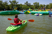 Lifeguard in a kayak at floating playground