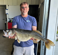 Angler holding a state record walleye
