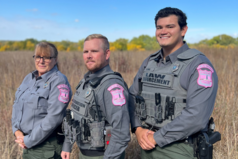 Three conservation officers posing for a picture