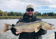 Man holding a very large walleye