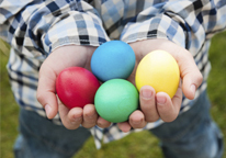 Closeup of a boy's hands holding Easter eggs